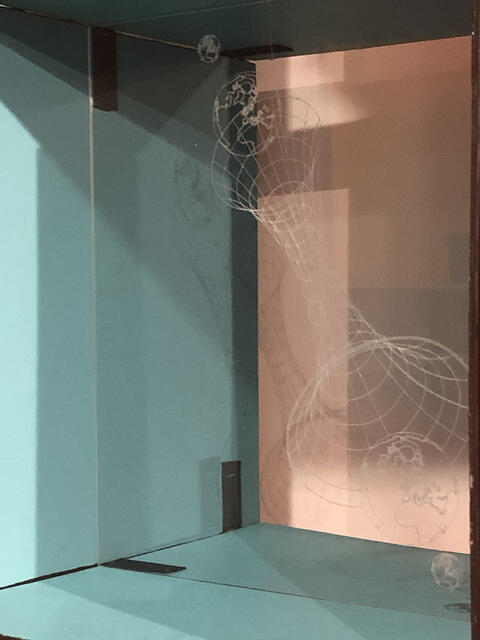 A wire form drawn against a studio wall