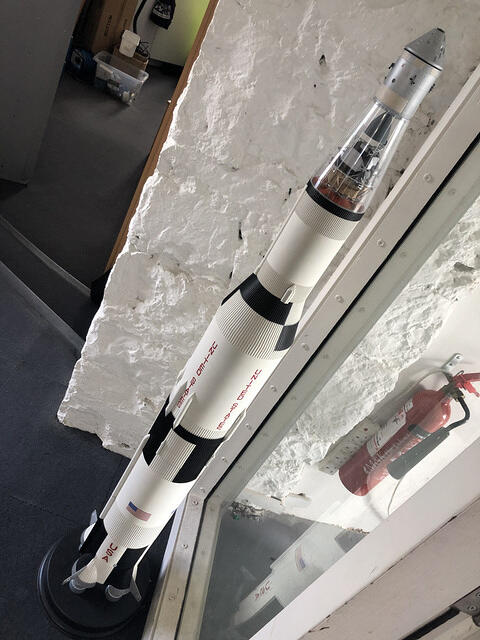 Scale rocket models on a studio windowsill